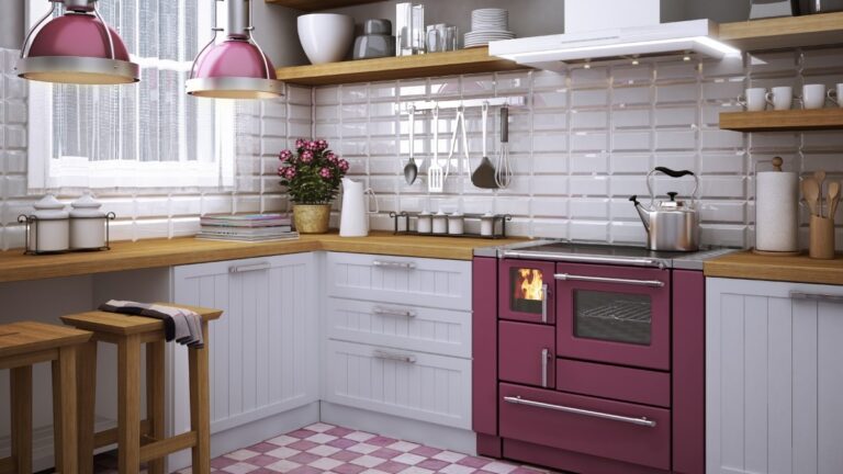 Cocina de leña Wamsler K138F Creative Line con horno de gran capacidad. Diseño de piedra elegante, placa de acero y doble tiro bávaro.